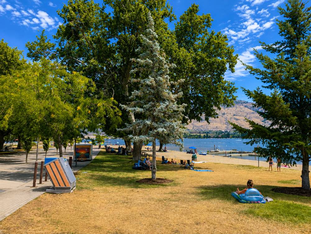 Shaded lawn and beach at Gyro Park, Osoyoos, in summer